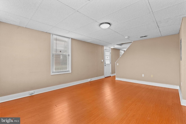 basement featuring hardwood / wood-style floors