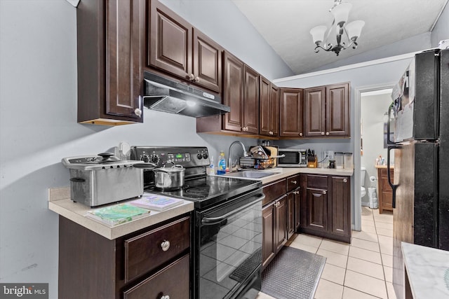 kitchen featuring light tile patterned flooring, lofted ceiling, sink, black appliances, and dark brown cabinets