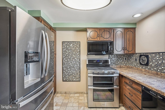 kitchen with tasteful backsplash and black appliances