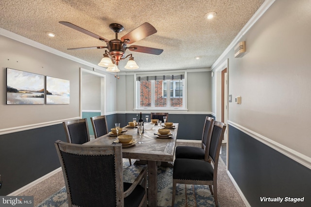 carpeted dining area featuring ceiling fan, crown molding, and a textured ceiling