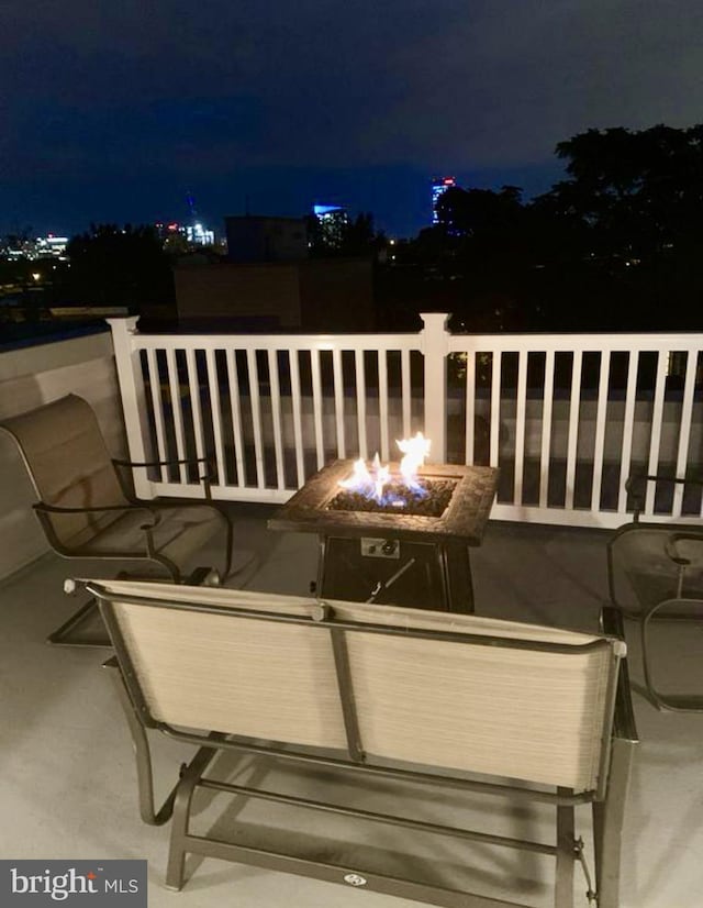 2312 Pierce St, Philadelphia, PA 19145 - deck at night with an outdoor fire pit