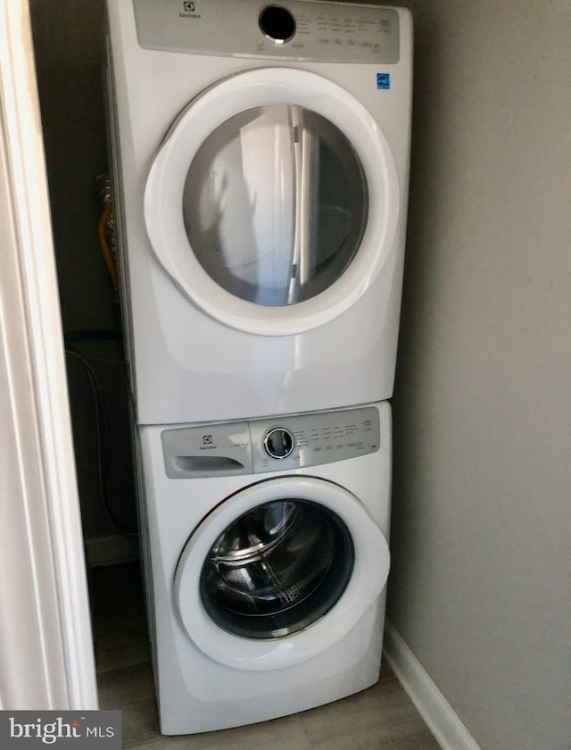 2312 Pierce St, Philadelphia, PA 19145 - laundry room featuring estacked washer and dryer and baseboards