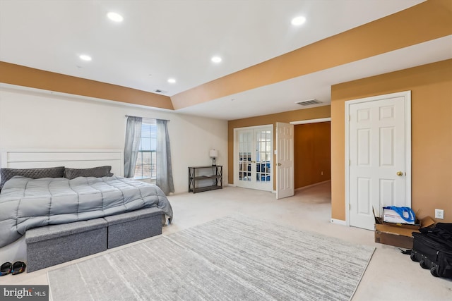 bedroom featuring light carpet