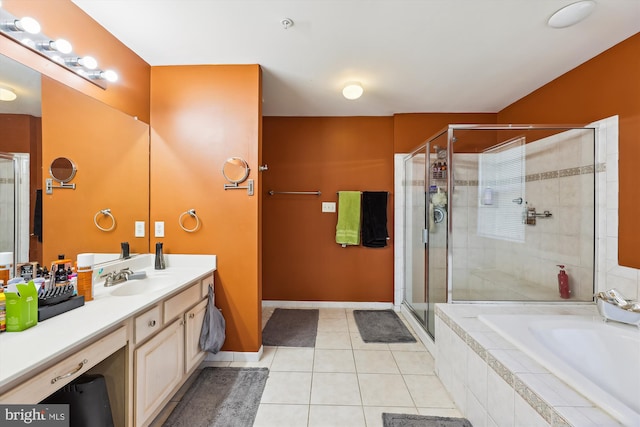 bathroom featuring vanity, tile patterned flooring, and plus walk in shower