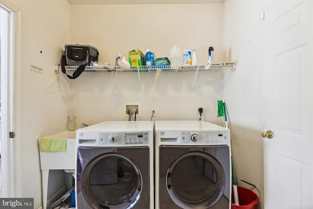 laundry room with washer and clothes dryer