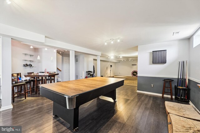 game room with dark hardwood / wood-style floors