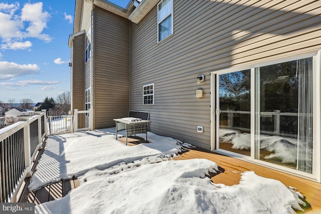 view of snow covered deck