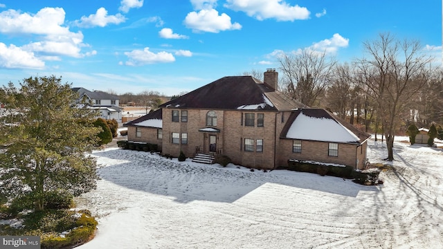 view of snow covered house