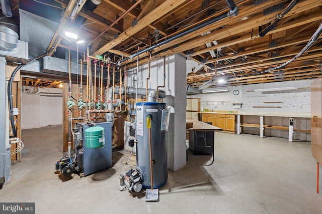 basement with water heater and a workshop area