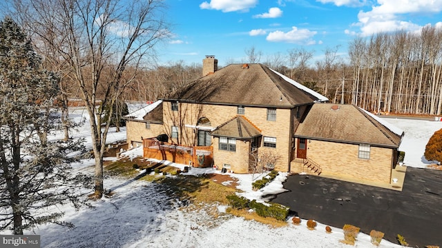 view of snow covered property