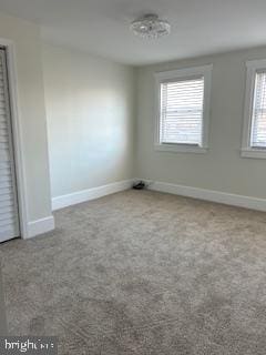 empty room with carpet flooring