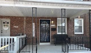 entrance to property featuring a porch