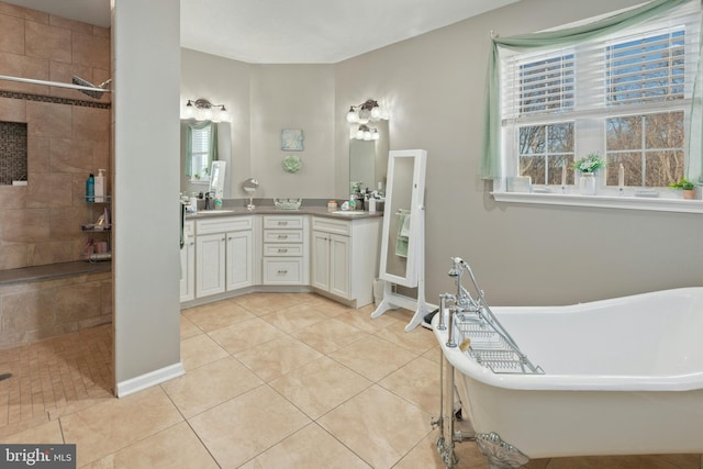 bathroom featuring plus walk in shower, tile patterned flooring, and vanity