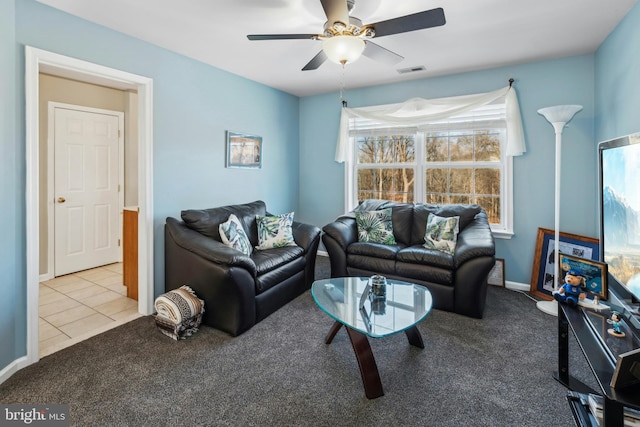 living room featuring ceiling fan and light carpet