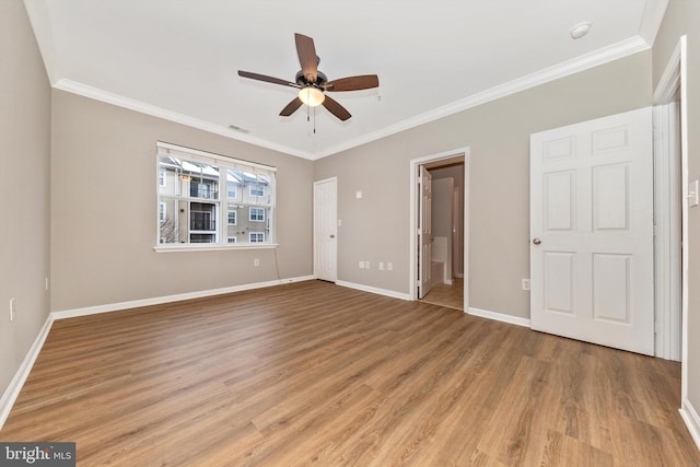 interior space featuring light hardwood / wood-style floors, crown molding, and ceiling fan