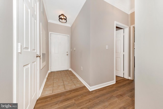 interior space featuring crown molding and wood-type flooring