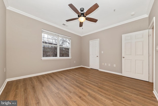 unfurnished bedroom with hardwood / wood-style flooring, ceiling fan, and ornamental molding