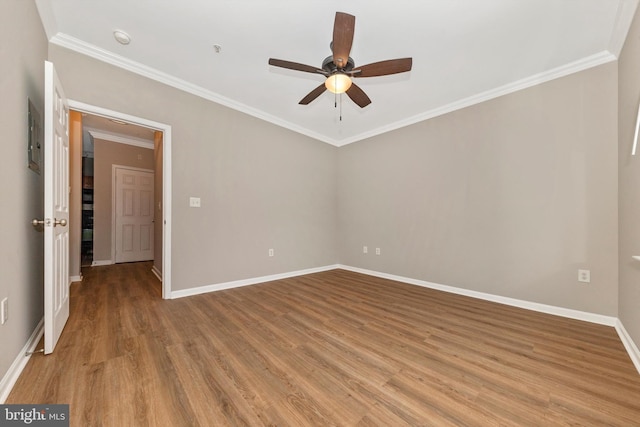 unfurnished room featuring ceiling fan, ornamental molding, and light wood-type flooring