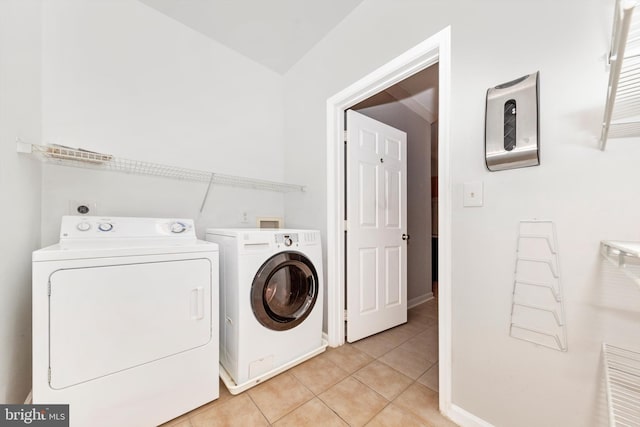 laundry room featuring light tile patterned floors and washer and dryer