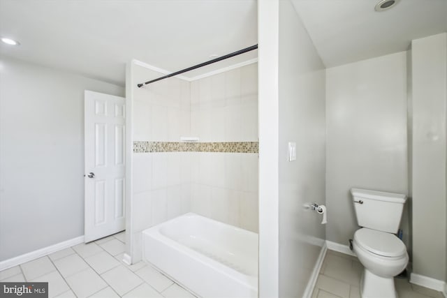 bathroom featuring toilet, tile patterned floors, and shower / bathing tub combination