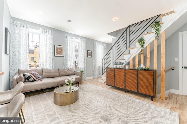 living room with light hardwood / wood-style flooring