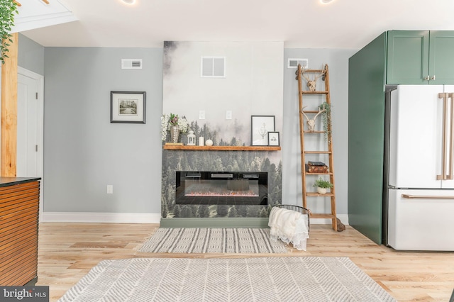 unfurnished living room featuring light wood-type flooring