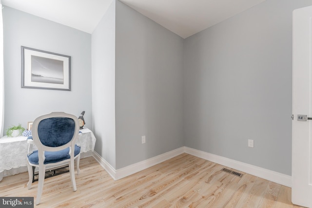 sitting room featuring wood-type flooring