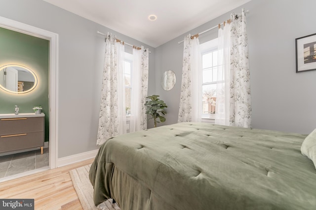 bedroom with light wood-type flooring