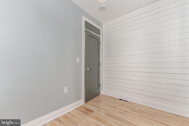 spare room with light hardwood / wood-style flooring