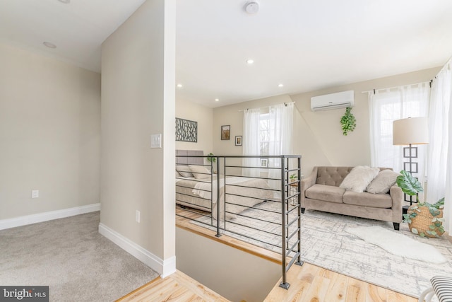 staircase featuring carpet flooring and a wall mounted air conditioner