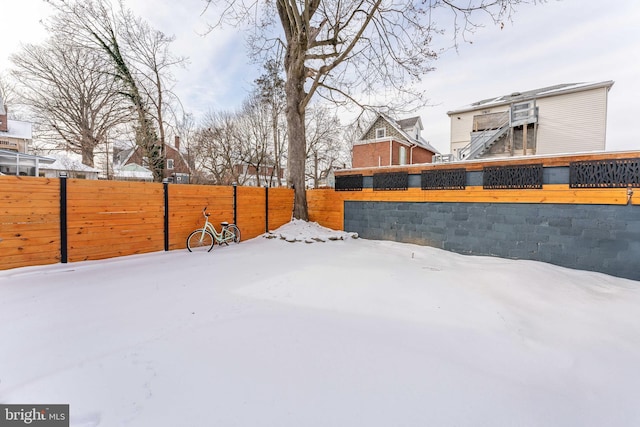 view of yard covered in snow