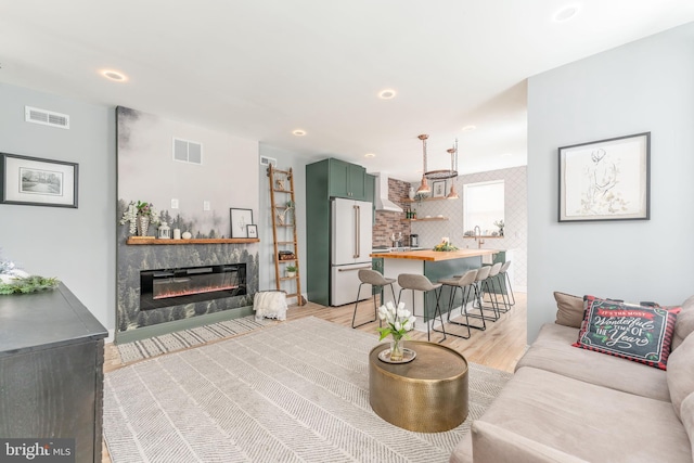 living room with light hardwood / wood-style flooring