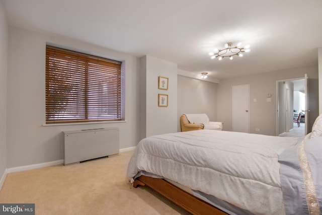 bedroom featuring light carpet