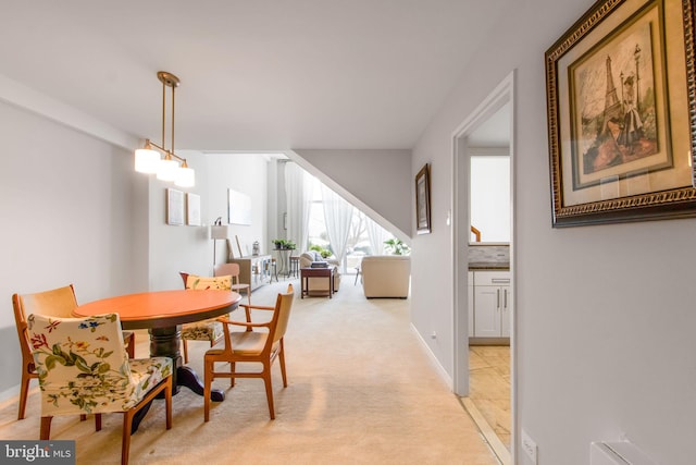 view of carpeted dining area