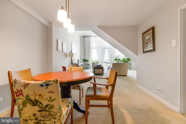 view of carpeted dining area