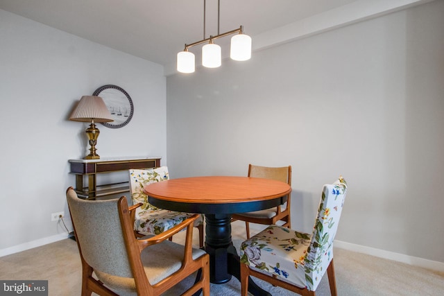 view of carpeted dining area