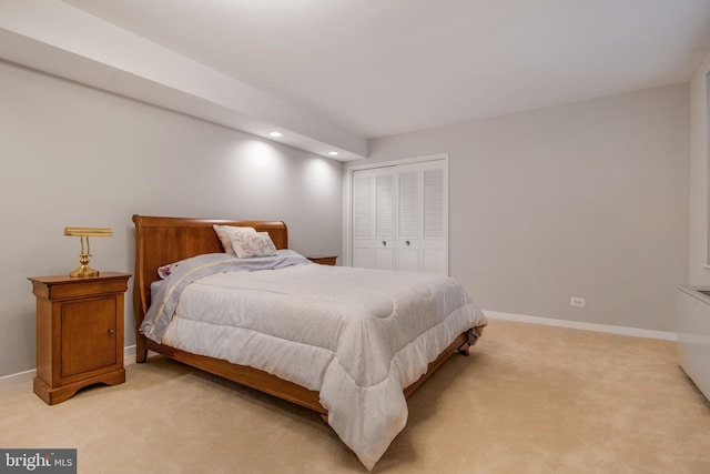 carpeted bedroom with a closet