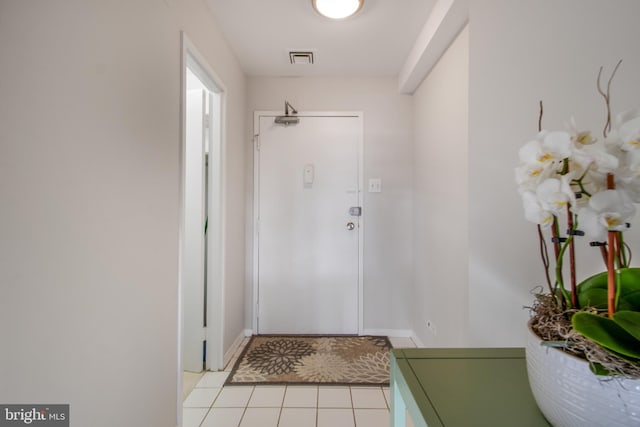 entryway featuring light tile patterned floors