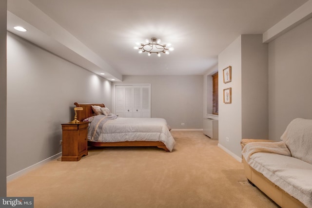 bedroom with light colored carpet and a closet