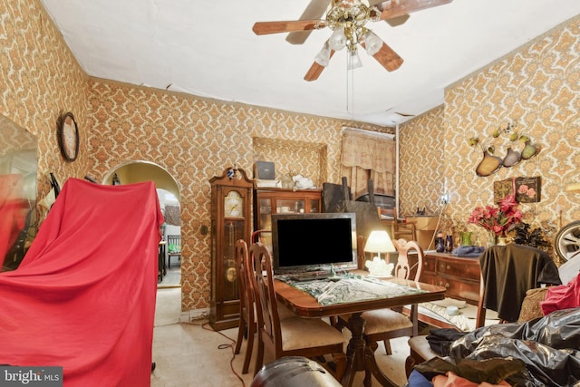 interior space with ceiling fan