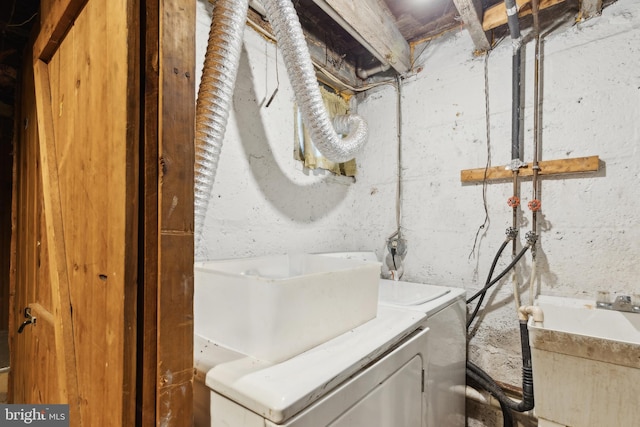 washroom with sink and washer / clothes dryer