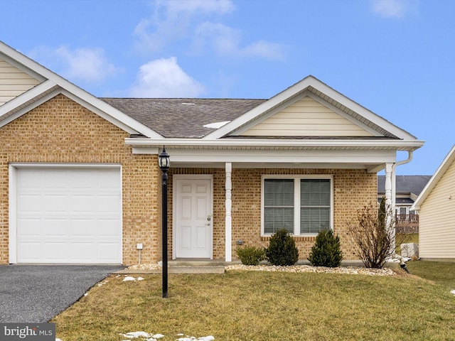 view of front facade with a garage and a front lawn