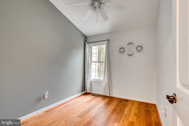 unfurnished room with light wood-type flooring, ceiling fan, and lofted ceiling