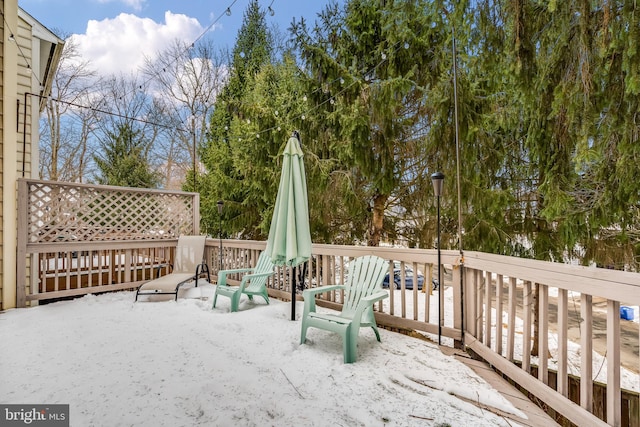 view of snow covered deck