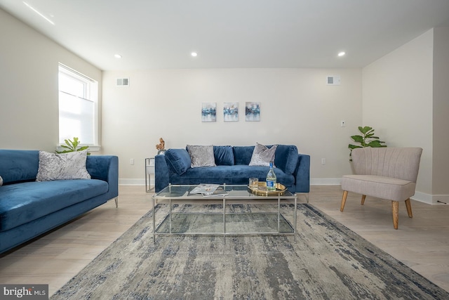 living room with light hardwood / wood-style flooring