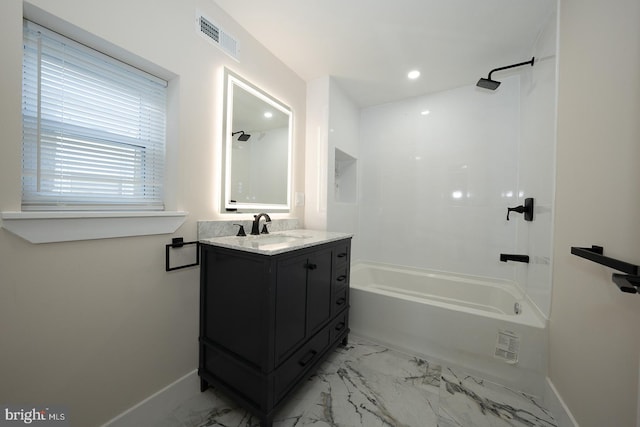 bathroom with vanity and shower / washtub combination