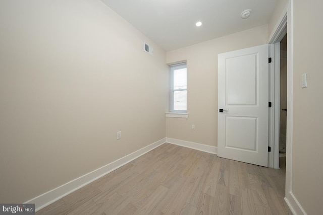 unfurnished room featuring light wood-type flooring