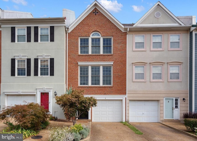 multi unit property featuring a garage