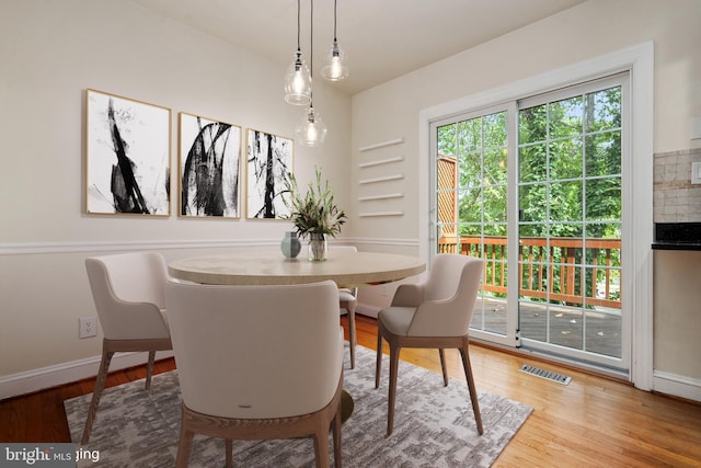 dining room featuring wood-type flooring