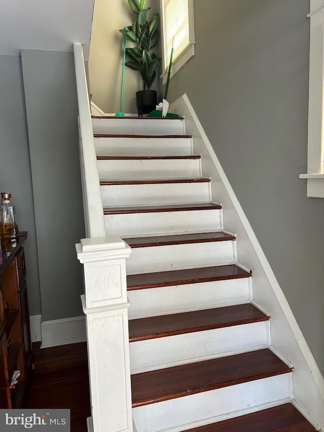 stairway featuring hardwood / wood-style floors